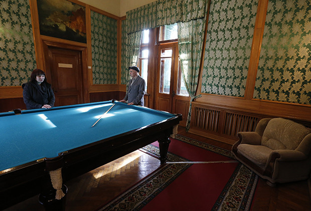 Visitors visit billiard room of Soviet dictator Joseph Stalinís Villa in Sochi