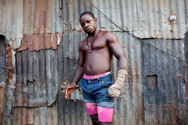 Lagos, Nigeria- Dambe boxer 'Shago' Rikishi, 25, poses for a por
