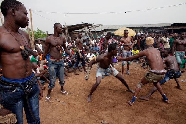 Lagos, Nigeria- A match between two fighters is stopped by anoth